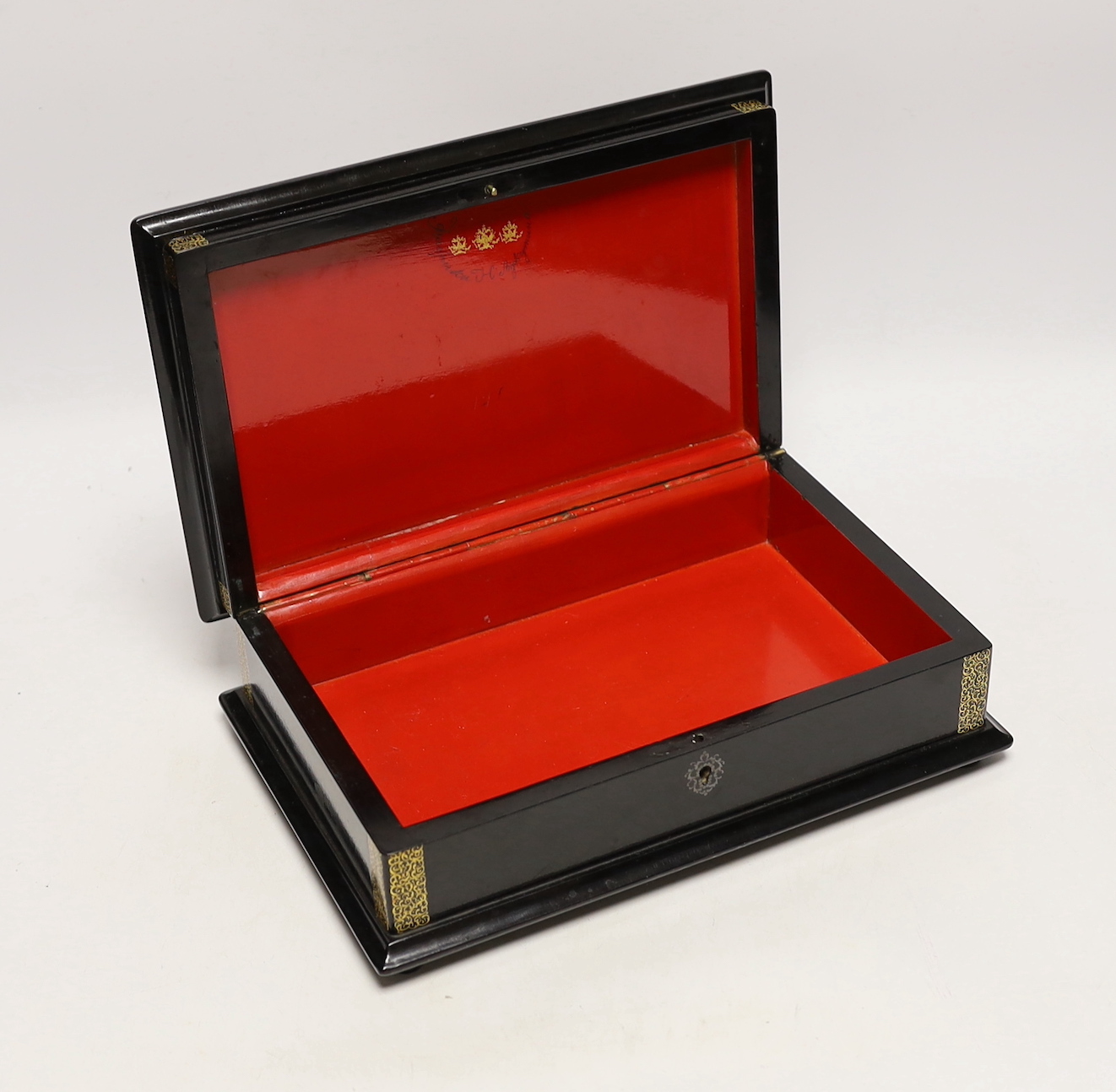 A large Russian lacquer box, by Lukutin, pre-1917, painted with a nobleman and guest in an interior, 26cm, Please note this lot attracts an additional import tax of 5% on the hammer price